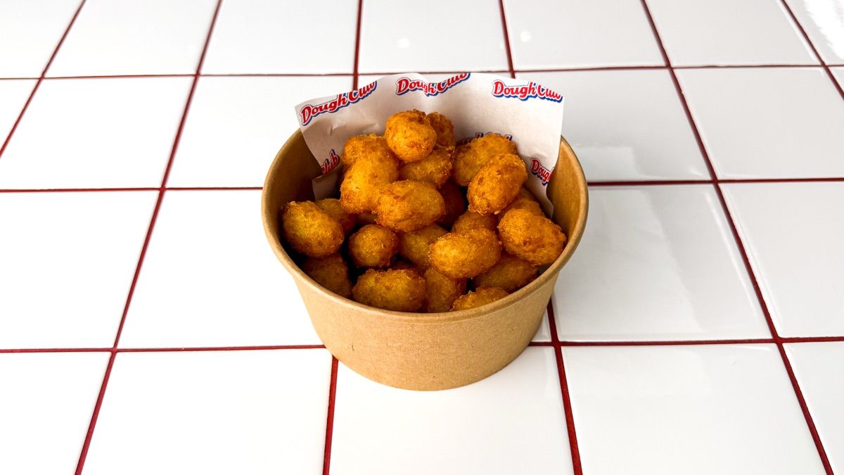 A tub of Dough Club tater tots