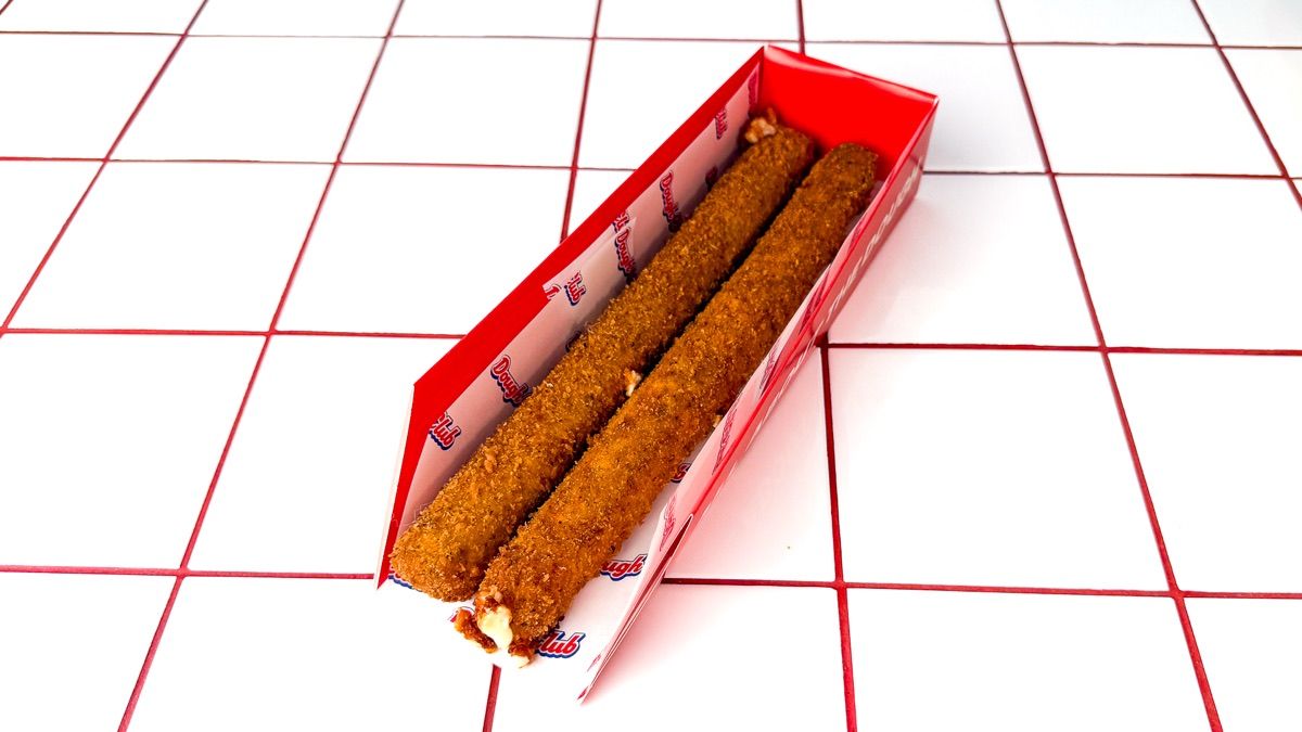 Two Dough Club footlong mozzarella sticks in a branded box